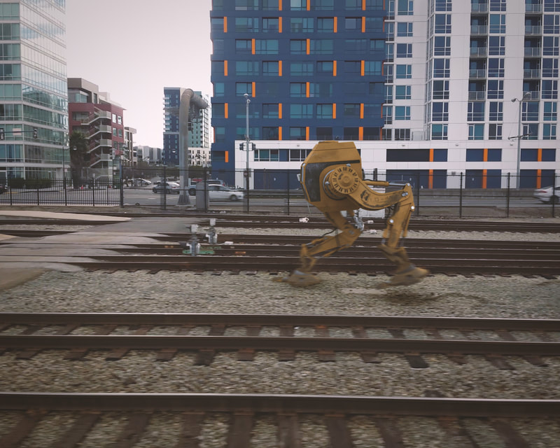 Robot walking along train tracks